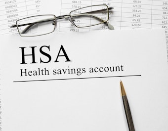 Paper with health savings account hsa on a table
