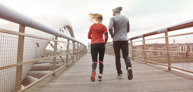 Couple running bridge